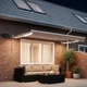 Ръчен изтеглящ се сенник с LED светлини Таупе 3 x 2 м