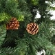 Изкуствено коледно дърво с шишарки, зелено, 210 см 